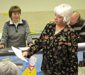 Sharon reads the minutes of the 2011 AGM (without the benefit of her glasses...)