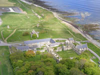 The long 'L' shaped building and the coach house with four arches form the main buildings of Castlehill Heritage Centre. Hugh can be seen st