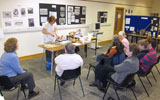 Liz finishing off the edges of a batch of Welsh cakes on the girdle