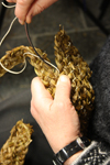 Stitching a basket using plaided strips
