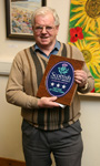 Hugh proudly reveals the Visit Scotland Three Star Grading plaque