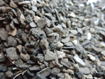 Tiny fragments (of slag perhaps?) from industrial activity present within the finds