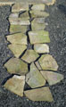 The pupils tried their hand at laying a short section of Caithness flagstone paving. Each piece bears the initials of a pupil
