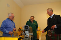 Fred Haughton and Alastair Hossack of North Highland Woodturners Association chat freely with HRH