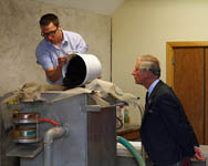 The Duke watches closely as Len processes a batch of finds material from a recent archaeological excavation through the wet sieveing process