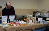 John mans the CHS display of fine soaps, cards and local literature