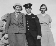 Isobel Custer, who created the tablecloth, standing on the left
