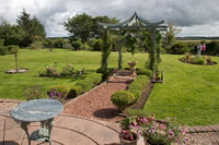 The oriental themed patio behind the house is most attractive