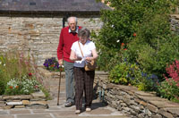 Two of our supporters taking a stroll round the garden