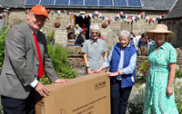 Past Chairman Neil Buchan presents Irene Wares (blue waistcoat) with her retirement gift Image courtesy of Gordon Mackie