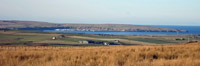 To the west, Scrabster lies sheltered by Holburn Head