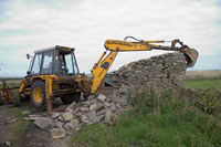 Over the years the rear wall had developed a decided lean towards the lower level field beyond.