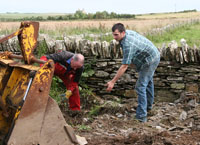 Neil and Gordon hand picking the remains of the usable material.