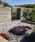 The RAF memorial Patch in front of the restored gate rescued from the ruins of Castlehill House