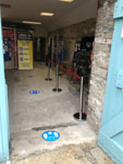 Social distancing markers and exhibit barriers are in place throughout the building