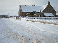 The approach to Castletown School with Olrig Hill in the background.