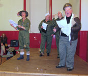 Issy and her Land Girls lead the community singing, complete with bubbles!