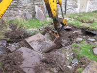 Some cover stones were found to be broken - the cause of the blockage. Those that were intact were carefully preserved for reuse