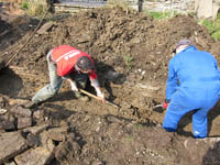 Gordon and John get stuck into clearing the channel of debris and accumulated silt