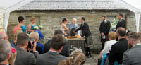 The 'handfasting' ceremony features the tying of cords to bind the wrists of the bride and groom together