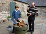 Muriel inspects the water mill, being restored to full action.