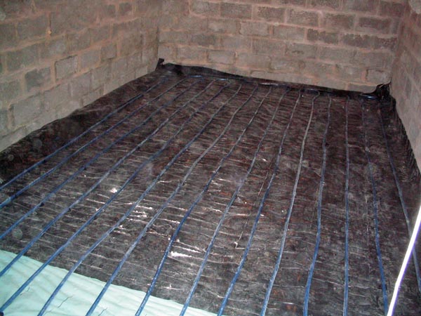 Underfloor heating pipes in place, ready for cement grout pour