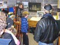 Muriel explaining the significance and provenance of some of our maritime paintings