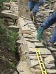 Note the inner face features to lock the wall into the earth back once backfilled.