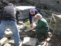 Dave Goulder demonstrates how to lay stones in an interlocking layer