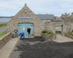 The entrance area gets the treatment. Keith lends a hand on the broom to keep things tidy.