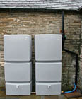 The two 750 litre storage tanks are located on the patio area immediately adjacent to the main entrance to the building